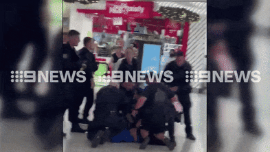 Dramatic arrest in Sydney Westfield after allegedly armed man flees police pursuit