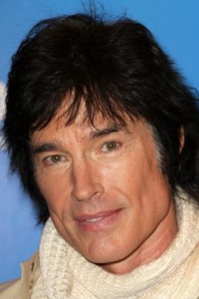 Actor Ronn Moss has two adult daughters but is in no rush for grandchildren, telling his daughters to "go out and enjoy your lives".