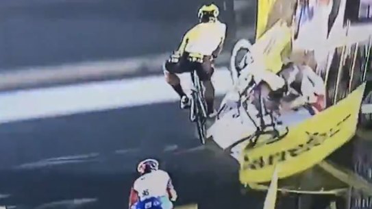 Fabio Jakobsen crashes through the barrier as he and Dylan Groenewegen collide in the Tour of Poland. 
