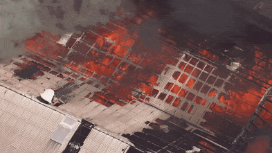 Firefighters battle enormous blaze at factory in Sydney’s south-west