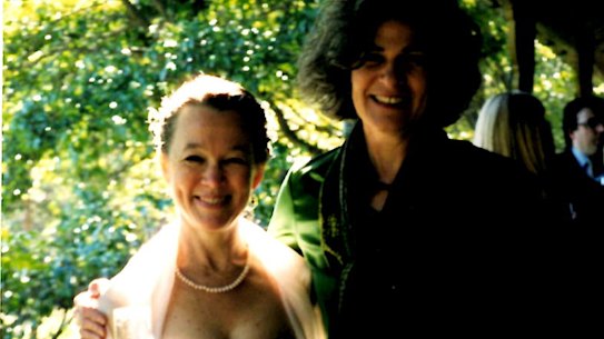 Gabrielle Carey (at left) and Debra Adelaide on Carey’s wedding day in May 2004 – the bride in pastels, bathed in sun, Adelaide literally in the shadows.