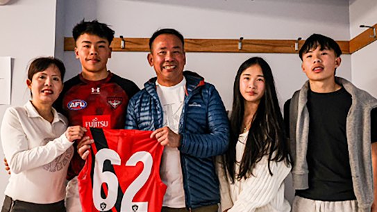 Mum Thuy, Jayden, his Dad Duc, and twin siblings, Jessica and Justin before making his debut in 2024 with Essendon VFL