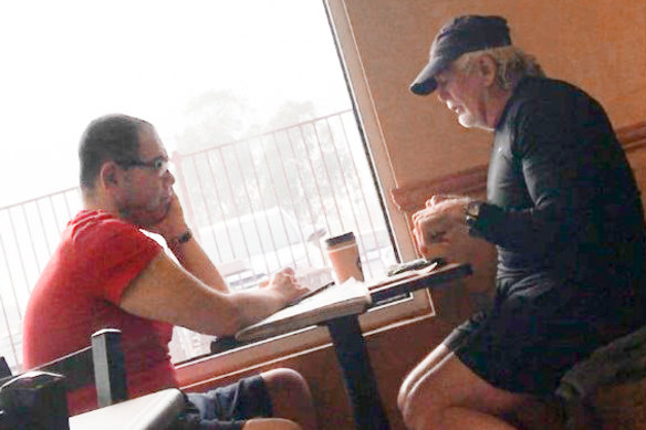 An IBAC surveillance photo of Sam Aziz (left) meeting developer John Woodman at a Subway restaurant in the suburb of Skye, in April 2018.