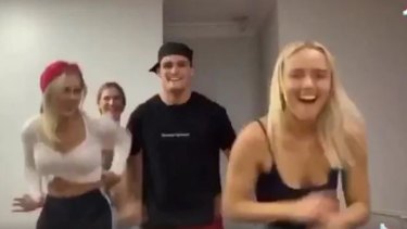  Nathan Cleary dancing with a group of women in a TikTok video.