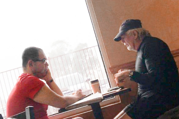 An IBAC surveillance photo of Casey councillor Sam Aziz (left) and developer John Woodman (right) at a Subway restaurant in April 2018. 