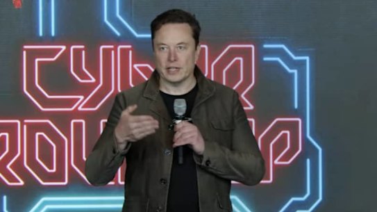 Elon Musk speaks at Tesla’s annual meeting in Texas.