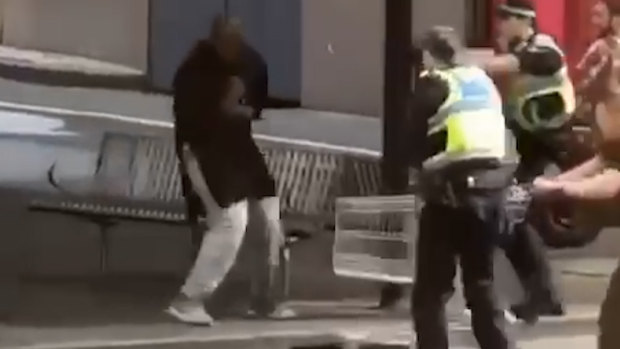Police confront the knifeman 