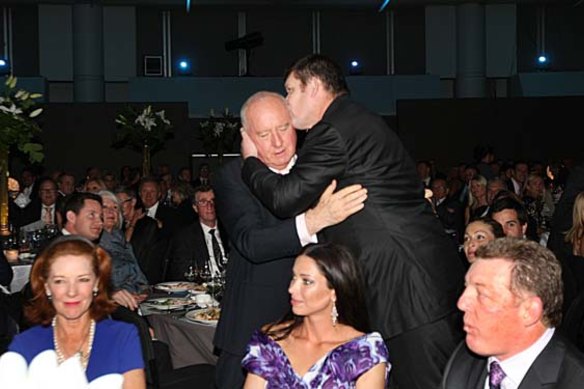 Alan Jones is embraced by James Packer in 2010 in front of Deeta Colvin, Erica Packer and Phil Gould.