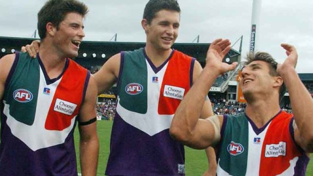 Justin Longmuir, with Leigh Brown and Matthew Pavlich in 2002, is a potential Dockers coach.