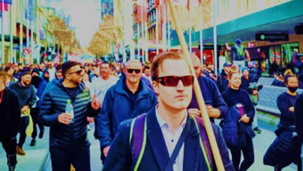 Harrison Mclean (front) was charged by police after the Melbourne lockdown protest rally on September 18.  