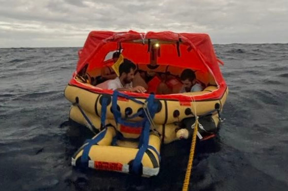 Rick Rodriguez and Simon Fischer in the life raft from the sunken Raindancer.