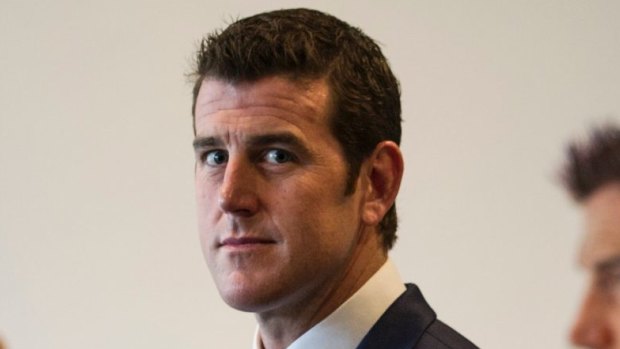 Ben Roberts-Smith in front of his portrait at the Australian War Memorial in Canberra. 