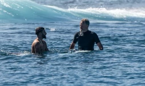 Brazilian world champion Italo Ferreira and Erik Logan in the water in Fiji.