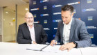 A contract signed a year ago by Qube commercial manager Simon Barney (left) and Martinus CEO Treaven Martinus has been scrapped 