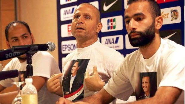 New man in charge: Interim Syria coach Fajr Ibrahim, wearing a T-shirt bearing the image of Syria President Bashar Al-Assad, pictured during a previous stint in charge of the national team.