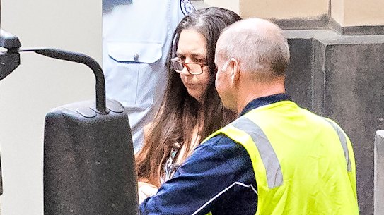 Erin Patterson leaves court after being sentenced to life in prison.