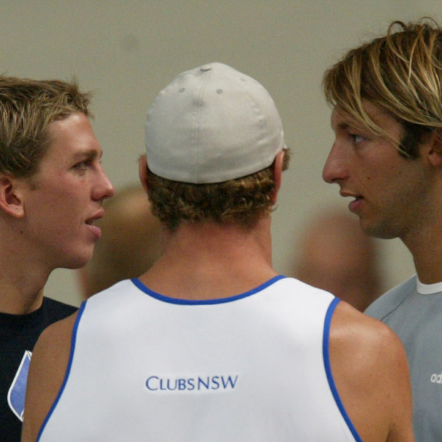 Craig Stevens, Simon Cowley (back turned) and Ian Thorpe share a conversation.