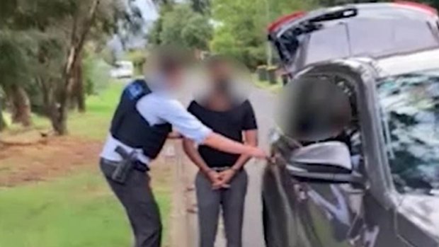 Australian Federal Police arrest a man in Thursday’s raid. 