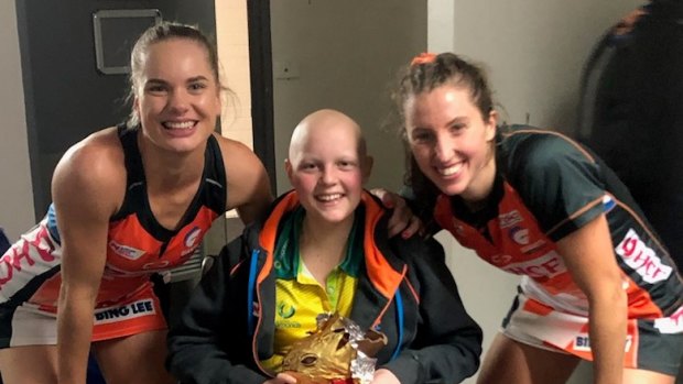 Giants players Kiera Austin and Amy Parmenter with Molly Croft.