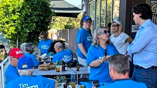 Tim Wilson supporters gather last week at Mr Brightside cafe in South Caulfield, with one sporting a purported MAGA cap.