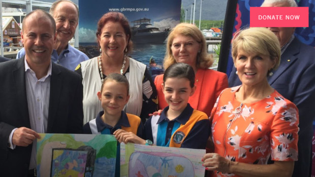 Josh Frydenberg, front,left, and Julie Bishop flank two students from a Reef Guardian school at the announcement in Cairns in April to grant the Great Barrier Reef Foundation almost half a billion dollars. 