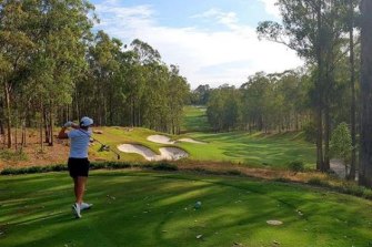 Barty plays a round of golf in Queensland.