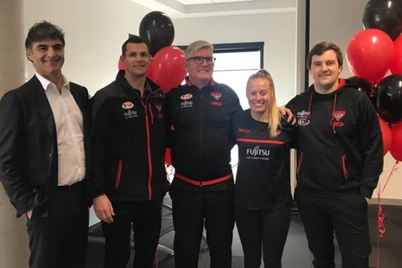 Mervyn Keane (centre) in his time as a recruiting manager at Essendon.