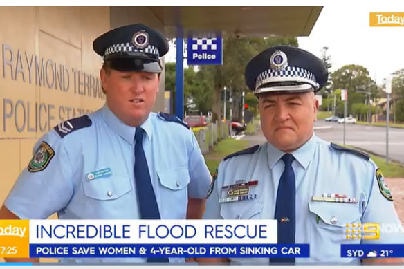 Senior Police Constable Richard Hansen (left), who rescued a four-year-old boy and two women from a car trapped in floodwaters near Dungog, and Detective Superintendent Wayne Humphrey, who said Hansen had shown “incredible bravery”.
