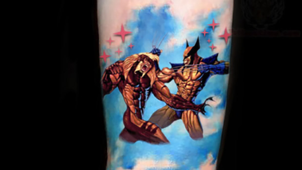 Jonathan Dick's Wolverine v Sabre-tooth tattoo.
