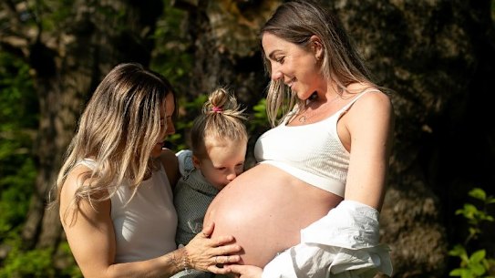 Katrina Gorry and heavily pregnant partner Clara Markstedt with their daughter Harper in May 2024.