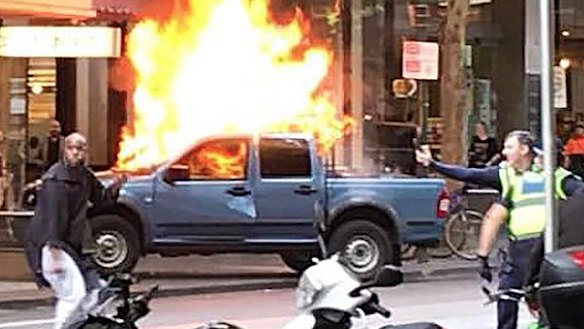 Police confront the Bourke Street attacker.