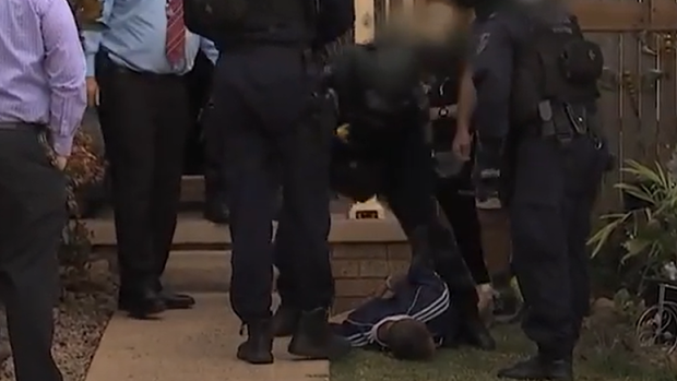Nathan McIvor is arrested at a St Helen’s Park home in 2019.