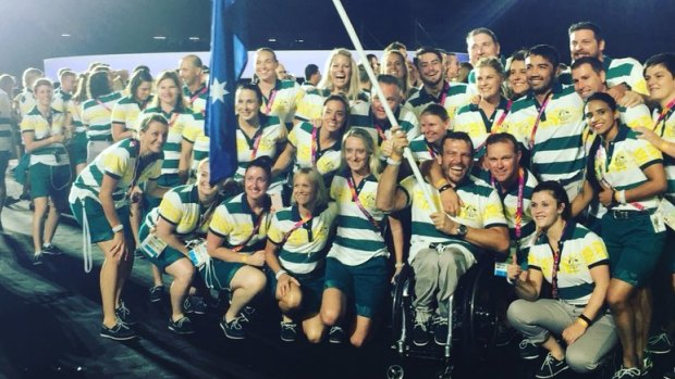 The Australian team with flag bearer Kurt Fearnley.