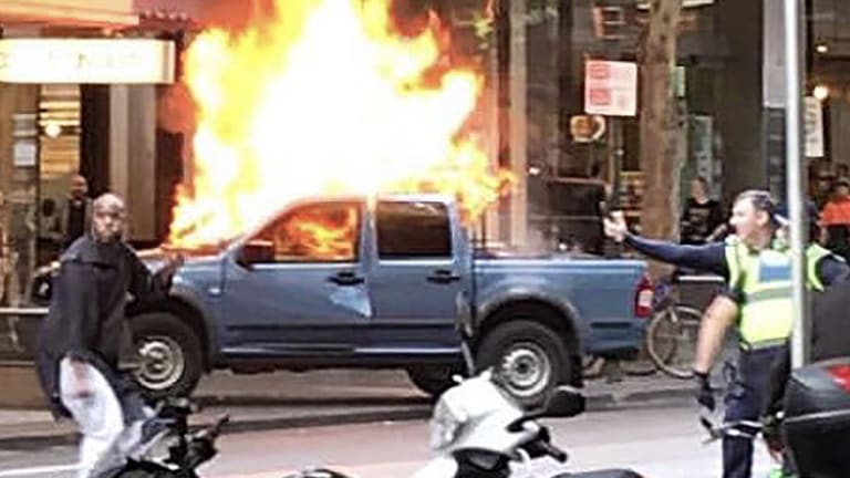 Image result for 24) Hassan Khalif Shire Ali sets his fire car on fire in Melbourneâ€™s Bourke street and starts stabbing people.