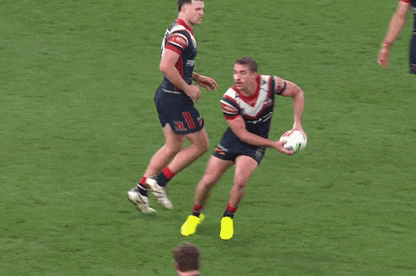 Latrell Mitchell crunches Toby Rodwell with a huge tackle.