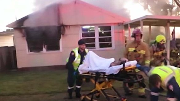 A critically injured man is rescued from a house fire in Seven Hills.
