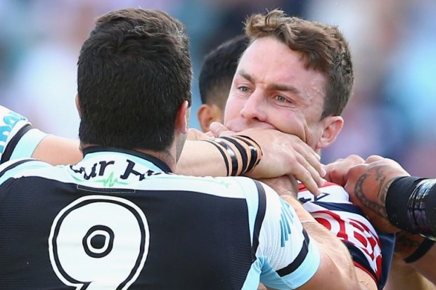 Cronulla’s Michael Ennis and Roosters’ James Maloney (both right) scuffle in 2015, one season before becoming Sharks teammates.