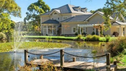 The $12m capital city home with a private lake and space for 25 cars