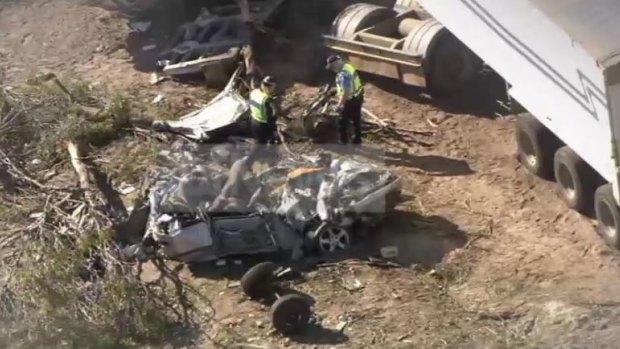 The impact of the crash pushed the car and the semi-trailer into a nearby paddock.
