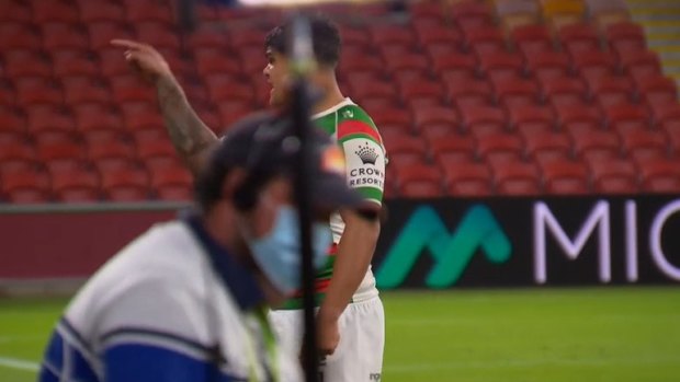 Latrell Mitchell exchanges words with Jared Wearea-Hargreaves after full time.