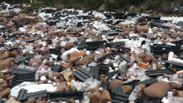 Some of the debris washed up on rocks at Jimmys Beach near Port Stephens.