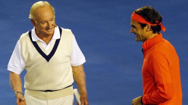 Australian tennis legend Rod Laver enjoys a bit of banter with Swiss champion Roger Federer at Rod Laver Arena during a charity event in Melbourne.
