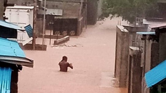 Rising waters create havoc in Dili on Sunday.