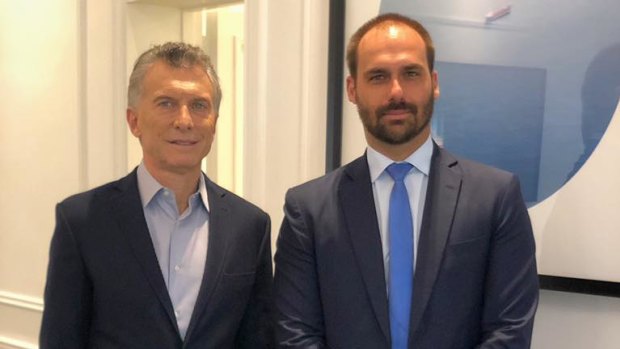 Brazilian congressman Eduardo Bolsonaro, right, meets with Argentina's President Mauricio Macri in May. Eduardo is one of President Jair Bolsonaro's three sons.