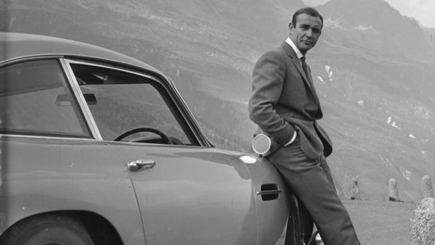 Connery poses with Bond's famous Aston Martin.
