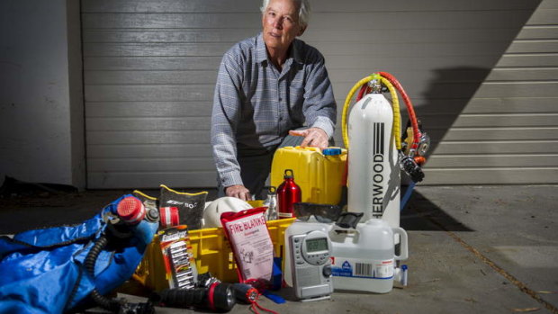 Ric Hingee with some equipment he has ready in case of fire at his home in Duffy.