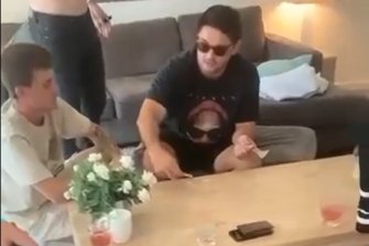 Cameron Munster and Brandon Smith in a Queensland hotel room with white powder on the table