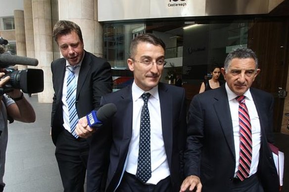 Joseph Georges (centre) leaves the ICAC inquiry in 2013 after being questioned on his connection to the Obeids.