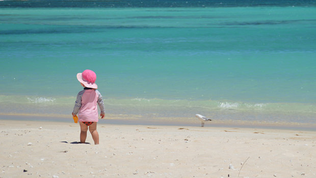 Ruby takes in the vista at Turquoise Bay in the Cape Range National Park.