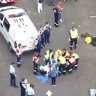 Woman pinned under car wheel outside Sydney primary school